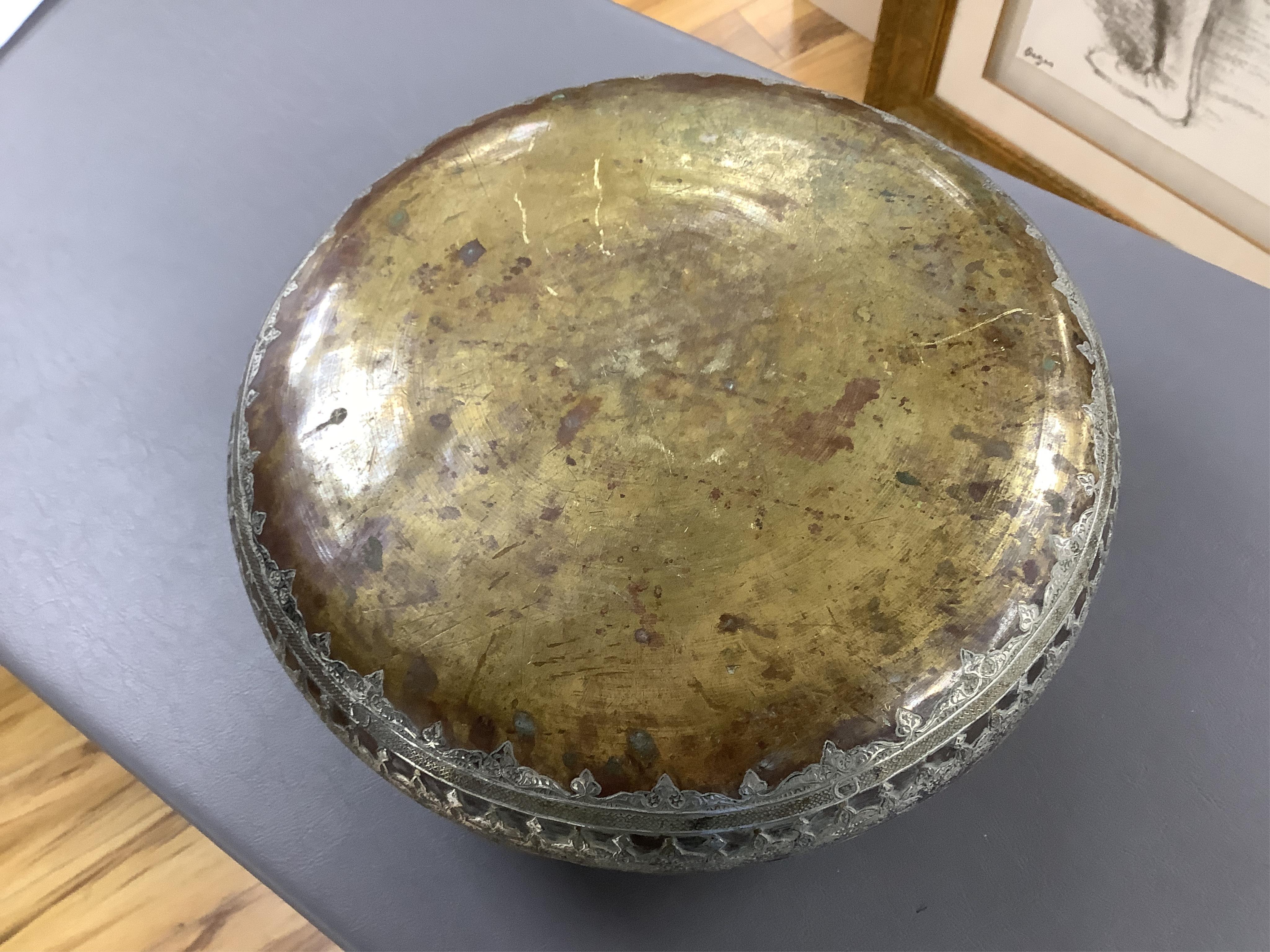 A late 19th century Mamluk style brass basin inlaid with silver and copper decoration, 29cm diameter